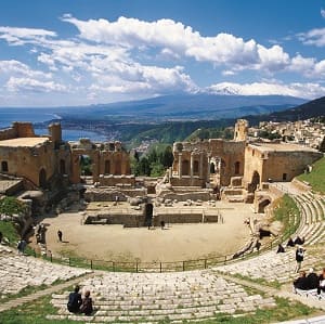 Tourists visiting the amphitheater of the Teatro Greco di Taormina