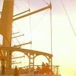 Windstar Cruise ship set against a golden sunset