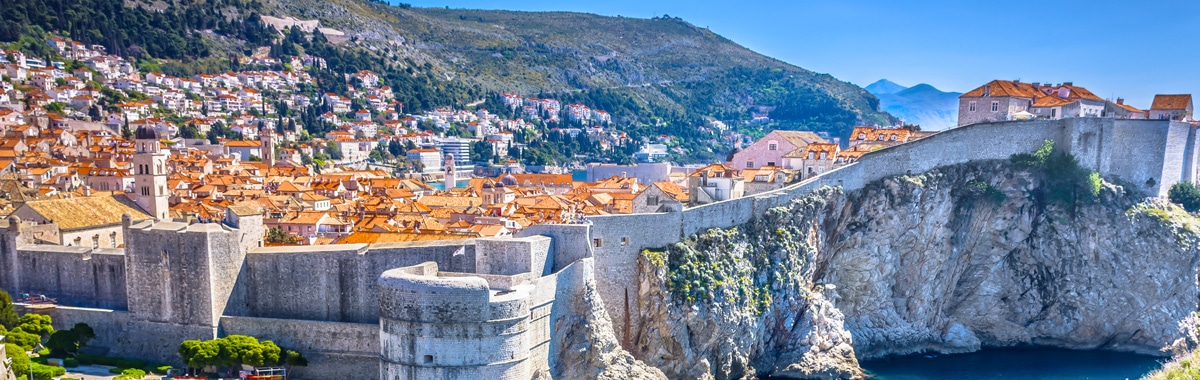 The walls of Dubrovnik and the orange roof tiles of the buildings in the city