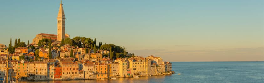 City on the shoreline at golden hour