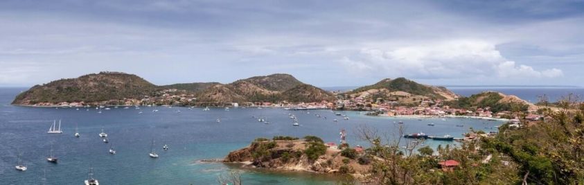 Aerial view of boats in a blue watered bay