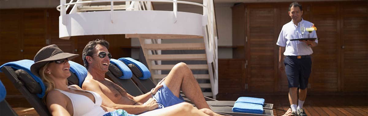 Lounging on deck Guests-lounging-deck-chairs